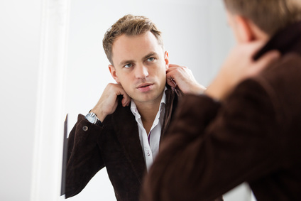 Man looking into mirror wondering about how he identifies with Christ